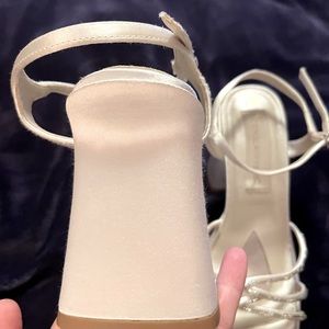 White satin wedding shoes with beadwork